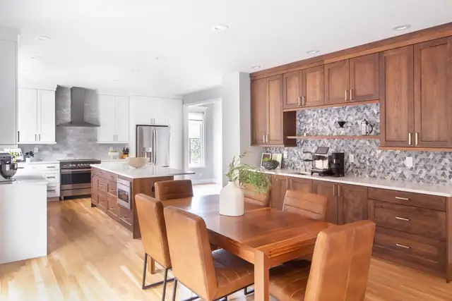 Portland kitchen remodel with stained wood cabinets, a patterned tile backsplash and a wood dining table